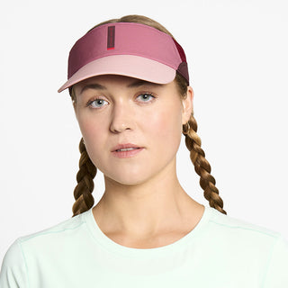 front view of ciele athletics FSTCap Comp Iconic VC unisex running hat in deco rose color on a model