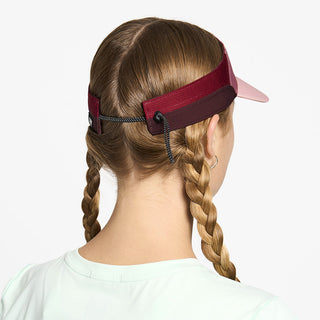 back view of ciele athletics FSTCap Comp Iconic VC unisex running hat in deco rose color on a model