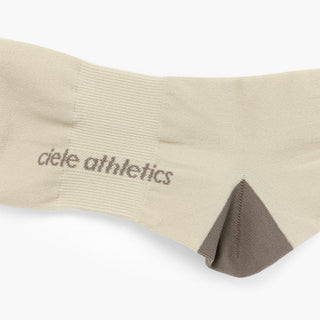 beige sock with brown accents and 'ciele athletics' branding on a white background
