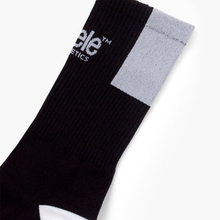 elastic of black sock with white patch on a white background