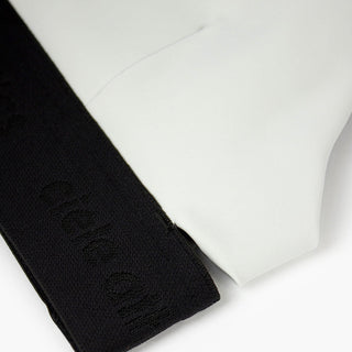 close view of the elastic and fabric of the ciele athletics QCKBra running bra in light grey