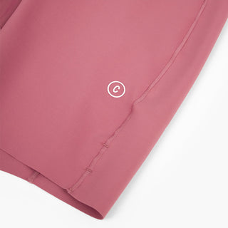 close view of the C logo on the ciele athletics FSTTight short running short in deco rose