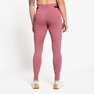 back view of ciele athletics FSTTight running tight in deco rose on a model