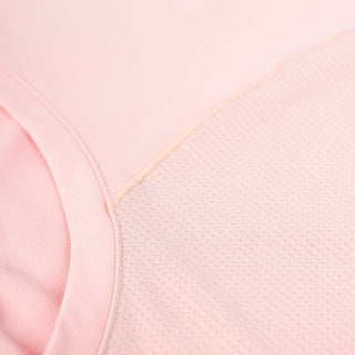 close view of the back reflective detail on the ciele athletics DLYTSinglet lightweight and performance driven singlet in peachskin